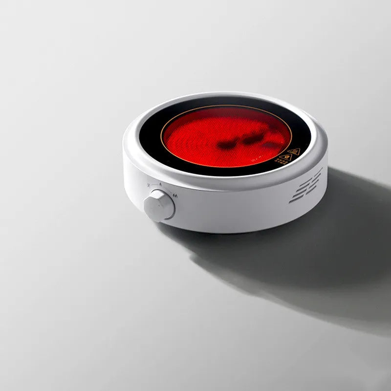 The Electric Earthenware Oven Is Used To Boil The Teapot